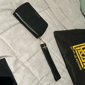 Pour La Victoire black leather clutch wristlet with wrist/hand strap